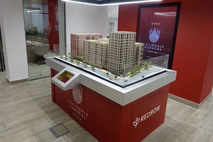 Cased 1:100 model in a showroom of a large apartment development